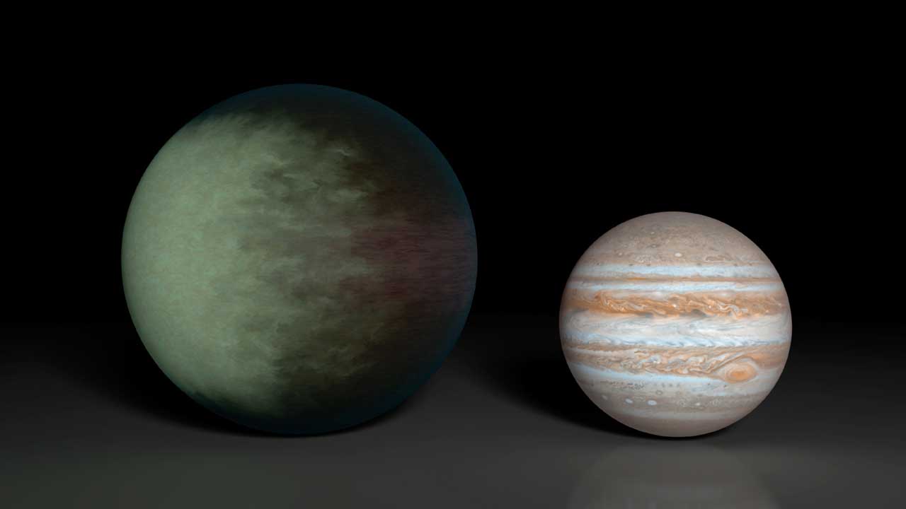 Greenish blue clouds are see on an exoplanet compared with Jupiter in this artist's illustration