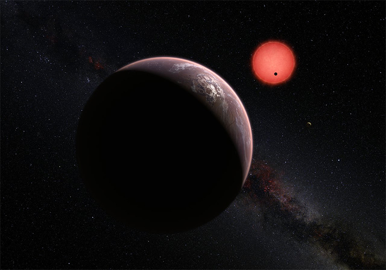 Artist’s impression of the ultracool dwarf star TRAPPIST-1 and its three planets. In this view one of the inner planets is seen in transit across the disc of its tiny and dim parent star. Credit: ESO/M. Kornmesser/N. Risinger