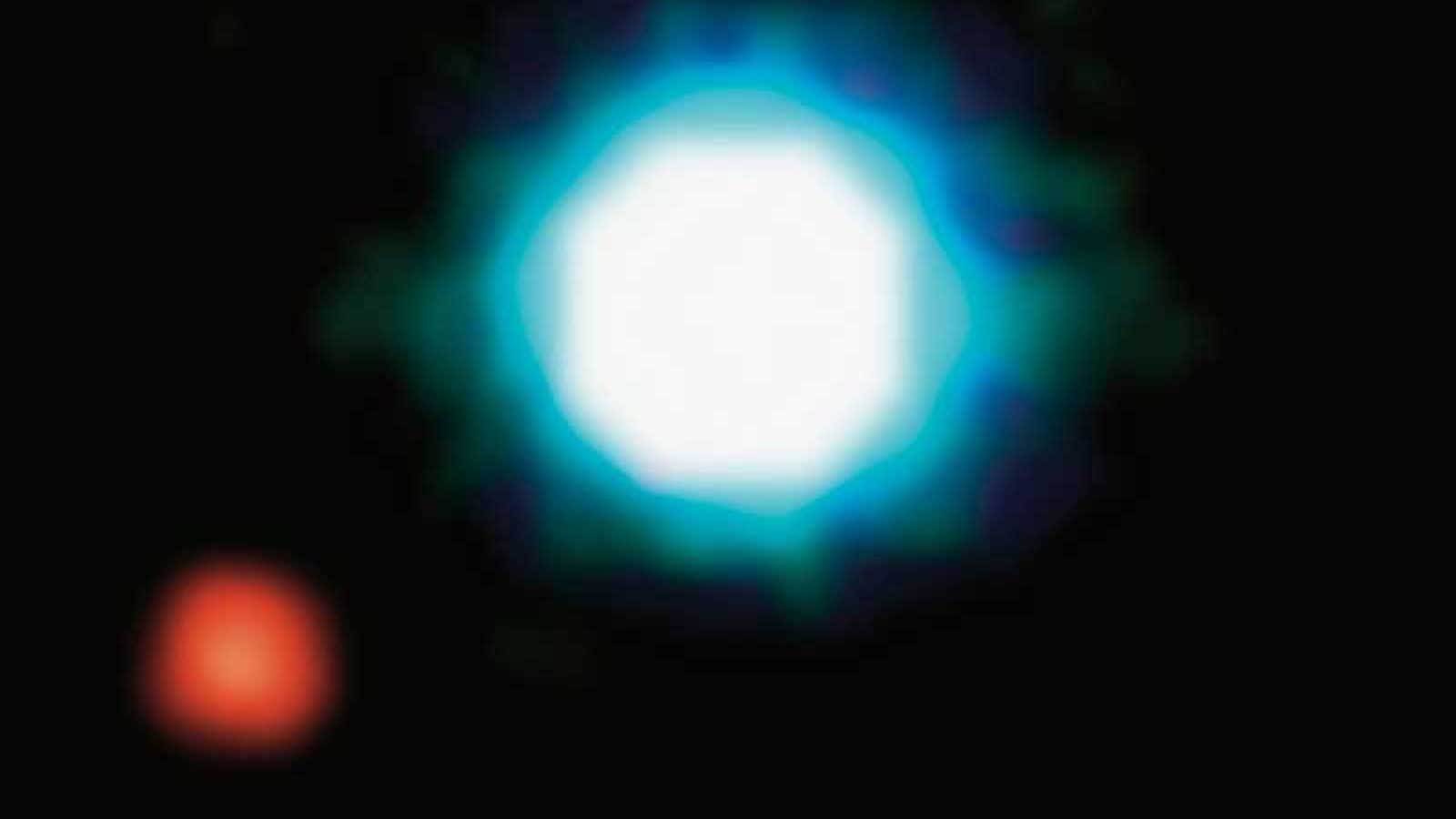 slide 3 - A large, bright star is seen with a smaller red exoplanet.