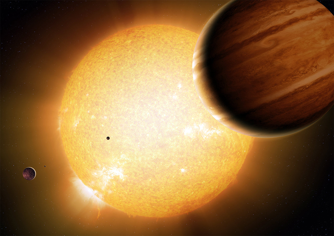 An artist’s portrayal of a Warm Jupiter gas-giant planet in orbit around its parent star, along with smaller companion planets.