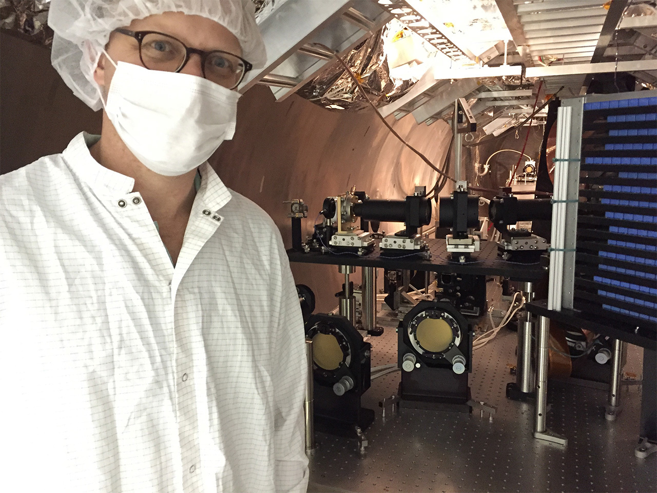 Photo of scientist with instrument