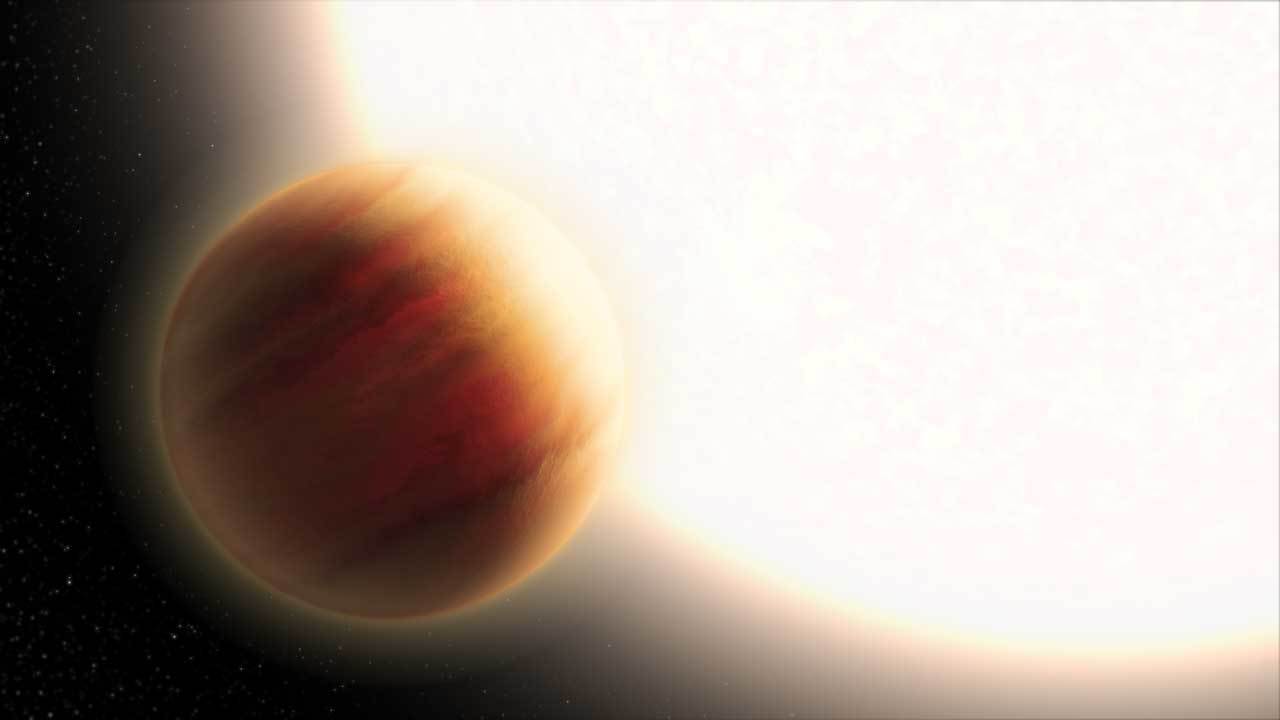 A large white hot star is seen with a giant exoplanet close by