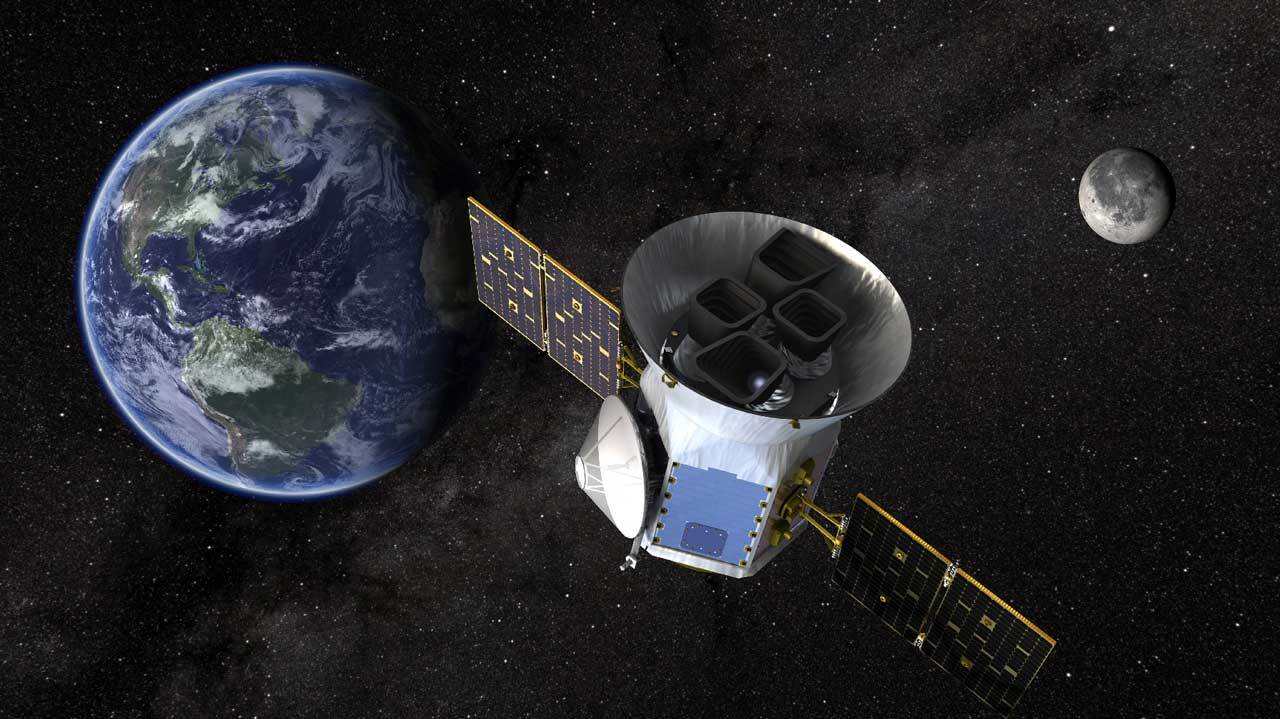 An illustrated image of the TESS spacecraft with Earth and the moon