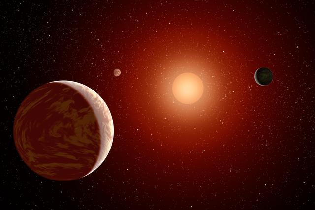 This artist's concept illustrates a young, red dwarf star surrounded by three planets. Such stars are dimmer and smaller than yellow stars like our sun, which makes them ideal targets for astronomers wishing to take images of planets outside our solar system. Image credit: NASA/JPL-Caltech