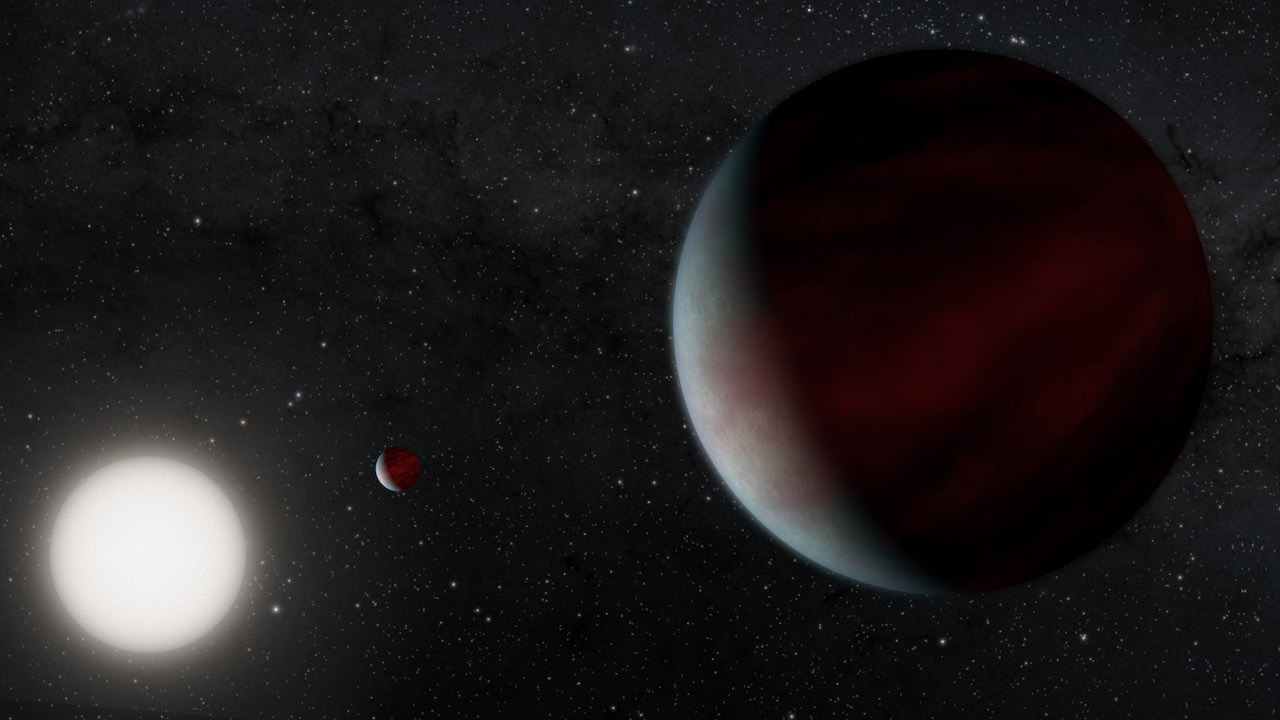Artist's rendering of two Saturn-sized planets orbiting a Sun-like star called EPIC 249731291.